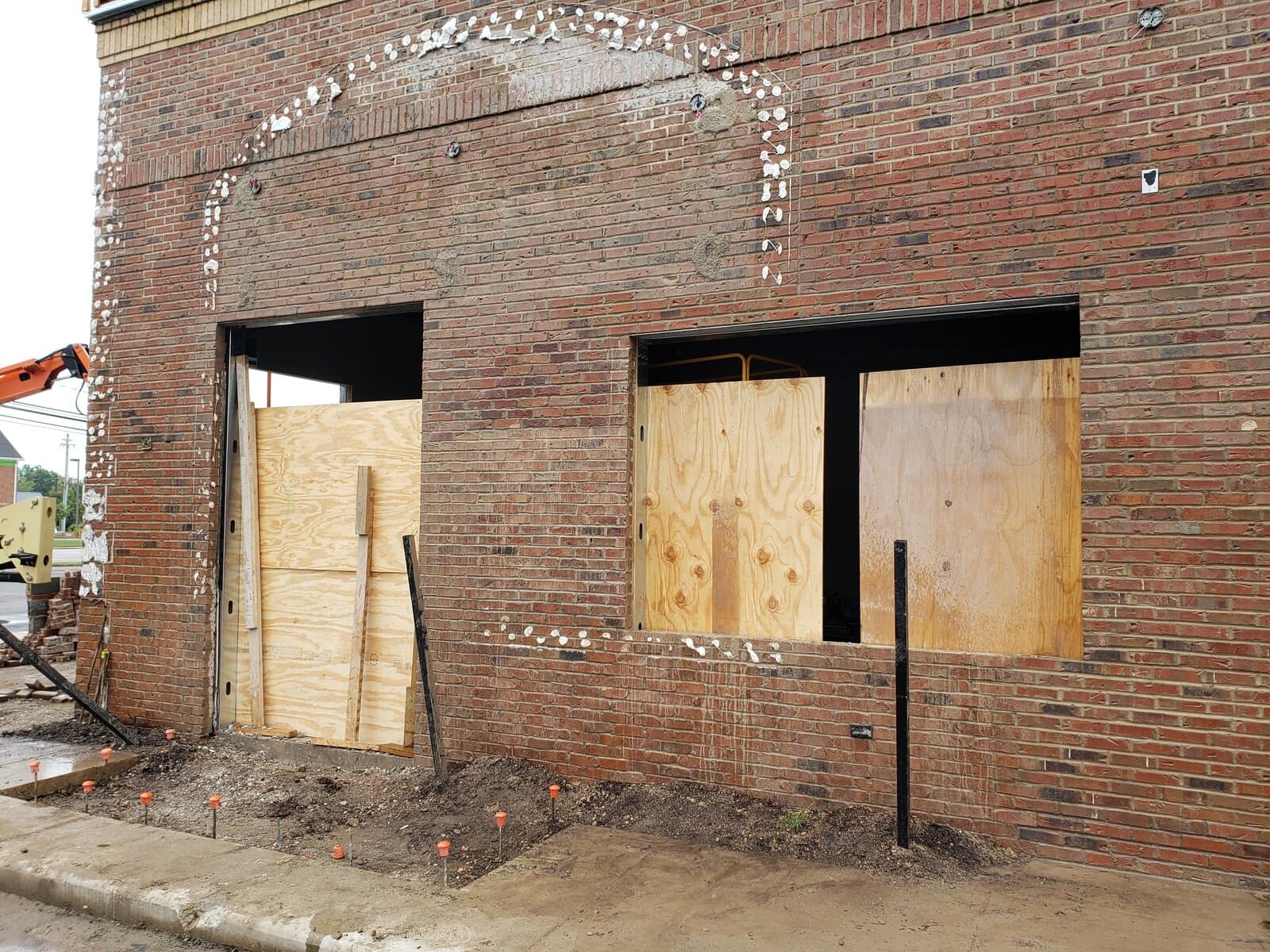 Brick building facade with mortar joints needing inspection